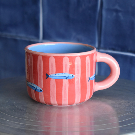 Taza rayas y peces roja