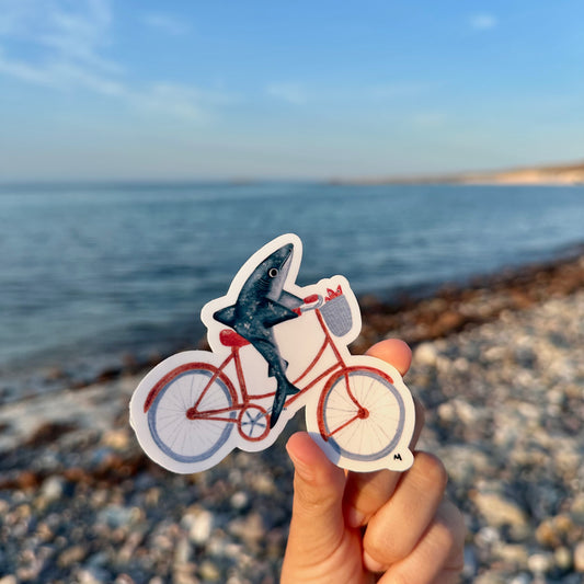 Sticker tiburón en bicicleta